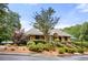 Charming clubhouse with beautiful landscaping, entryway awning, and brick stairs at 4987 Day Lily Nw Way, Acworth, GA 30102