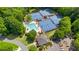 Aerial view of the community pool and tennis courts surrounded by mature trees at 4987 Day Lily Nw Way, Acworth, GA 30102