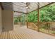 Wooden deck with spiral staircase and wooded view at 4987 Day Lily Nw Way, Acworth, GA 30102
