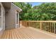 New deck with wooden railings and wooded view at 4987 Day Lily Nw Way, Acworth, GA 30102