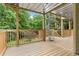 Wooden deck with spiral staircase and wooded view at 4987 Day Lily Nw Way, Acworth, GA 30102