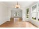 Bright and airy dining room with hardwood floors, wainscoting, and large windows with backyard views at 4987 Day Lily Nw Way, Acworth, GA 30102
