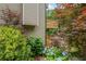 Exterior view of the home with a wooden deck and lush greenery at 4987 Day Lily Nw Way, Acworth, GA 30102