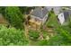 Rear exterior of a home with a multi-tiered deck and landscaped gardens at 4987 Day Lily Nw Way, Acworth, GA 30102