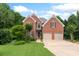 Charming two-story brick home with well-manicured lawn and mature trees at 4987 Day Lily Nw Way, Acworth, GA 30102