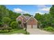 Charming two-story brick home with well-manicured lawn and mature trees at 4987 Day Lily Nw Way, Acworth, GA 30102