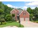 Charming two-story brick home with well-manicured lawn and mature trees at 4987 Day Lily Nw Way, Acworth, GA 30102