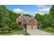 Beautiful two-story brick home featuring lush landscaping and a basketball hoop at 4987 Day Lily Nw Way, Acworth, GA 30102