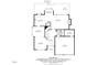 First floor layout of a home featuring a spacious kitchen, living room, dining room, and attached garage at 4987 Day Lily Nw Way, Acworth, GA 30102