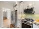 The kitchen features stainless steel appliances and granite countertops at 4987 Day Lily Nw Way, Acworth, GA 30102