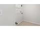 Empty laundry room with tile floors and wire shelving at 4987 Day Lily Nw Way, Acworth, GA 30102