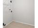 A laundry room with tiled floors and a wire rack at 4987 Day Lily Nw Way, Acworth, GA 30102