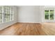 Bright room with hardwood floors and abundant natural light through large windows at 4987 Day Lily Nw Way, Acworth, GA 30102