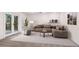 Modern living room with comfortable sectional sofa, accent chairs, and deck access at 4987 Day Lily Nw Way, Acworth, GA 30102