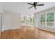 Open-concept living room with hardwood floors, white trim and a back deck view at 4987 Day Lily Nw Way, Acworth, GA 30102