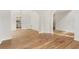 Spacious room with hardwood floors and a view of the dining area and kitchen at 4987 Day Lily Nw Way, Acworth, GA 30102