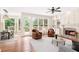Staged living room boasts hardwood floors, a fireplace, comfortable furniture, and natural lighting at 4987 Day Lily Nw Way, Acworth, GA 30102