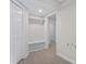 Well-lit mudroom with built in bench and hooks for storage at 4987 Day Lily Nw Way, Acworth, GA 30102