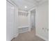 Mudroom featuring tile flooring, built-in bench with storage and hooks, and bright white trim at 4987 Day Lily Nw Way, Acworth, GA 30102