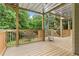 Covered porch featuring wood flooring, railings and a spiral staircase at 4987 Day Lily Nw Way, Acworth, GA 30102