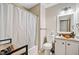 Full bathroom features a shower with a curtain, a large mirror, and a modern vessel sink at 592 Ferry Creek Ct, Acworth, GA 30102