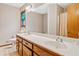 Bathroom with a double sink, vanity, and a shower with a curtain at 592 Ferry Creek Ct, Acworth, GA 30102