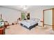 Cozy bedroom featuring carpet, a ceiling fan, a window, and a comfortable double bed at 592 Ferry Creek Ct, Acworth, GA 30102