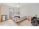 Bedroom with carpet, a ceiling fan, a double bed, and a window at 592 Ferry Creek Ct, Acworth, GA 30102