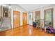 Inviting entryway with hardwood floors, staircase, and sunlit windows at 592 Ferry Creek Ct, Acworth, GA 30102