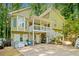 Charming two-story home featuring a spacious front porch and inviting curb appeal nestled among lush trees at 592 Ferry Creek Ct, Acworth, GA 30102