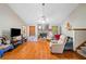 Bright living room featuring a stone fireplace and an open layout at 592 Ferry Creek Ct, Acworth, GA 30102