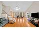 Spacious living room with hardwood floors, large windows, and ample natural light at 592 Ferry Creek Ct, Acworth, GA 30102