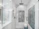 Elegant shower with glass enclosure and tiled wall design at 6313 Shoreland Cir, Buford, GA 30518