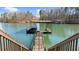 Dock with boat storage. Serene waterfront views at 6313 Shoreland Cir, Buford, GA 30518