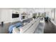 Bright living area showcasing stone fireplace, built-in cabinets, and modern decor at 6313 Shoreland Cir, Buford, GA 30518