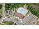 Gorgeous aerial view of community pool, clubhouse, and ample parking nestled among mature trees at 2870 Prestwood Dr, Cumming, GA 30040