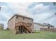 Expansive backyard featuring a wooden deck and stairs, perfect for outdoor entertaining at 2870 Prestwood Dr, Cumming, GA 30040