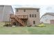 A spacious backyard with a deck, stairs, and plenty of room for gardening and outdoor activities at 2870 Prestwood Dr, Cumming, GA 30040