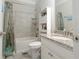 Bright bathroom featuring a tub-shower combination, granite countertop, and stylish tile work at 2870 Prestwood Dr, Cumming, GA 30040