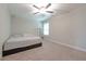 Neutral bedroom features a ceiling fan, a window with blinds, and neutral carpeting at 2870 Prestwood Dr, Cumming, GA 30040