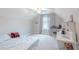 Bedroom under the eaves is well-lit and includes a desk and shelves at 2870 Prestwood Dr, Cumming, GA 30040