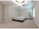 Neutral bedroom features a ceiling fan, a window with blinds, and neutral carpeting at 2870 Prestwood Dr, Cumming, GA 30040