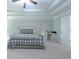 Bedroom with tray ceilings, carpet floors, light gray walls and a gray bed frame at 2870 Prestwood Dr, Cumming, GA 30040