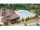 Aerial shot features pool area with slides, lounge chairs, and clubhouse for recreation at 2870 Prestwood Dr, Cumming, GA 30040