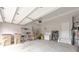 Garage with storage shelving, water heater, bike, and garage door opener at 2870 Prestwood Dr, Cumming, GA 30040