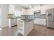 Bright kitchen features white cabinets, granite countertops, stainless steel appliances, and a functional island at 2870 Prestwood Dr, Cumming, GA 30040