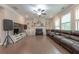 Spacious living room features hardwood floors, a fireplace, built-in shelves, and large windows for natural light at 2870 Prestwood Dr, Cumming, GA 30040
