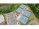 Aerial view features the community tennis courts surrounded by lush greenery and parking at 2870 Prestwood Dr, Cumming, GA 30040