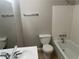 Clean bathroom featuring a bathtub, toilet, and modern vanity at 4902 Pine Hill E Ct, Stone Mountain, GA 30088
