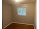 Cozy bedroom with hardwood floors and natural light from a large window at 4902 Pine Hill E Ct, Stone Mountain, GA 30088